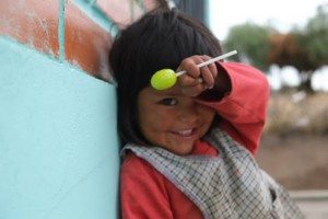 Clarita loves to be read to! Can you help us build reading corners in the libraries in Bolivia?